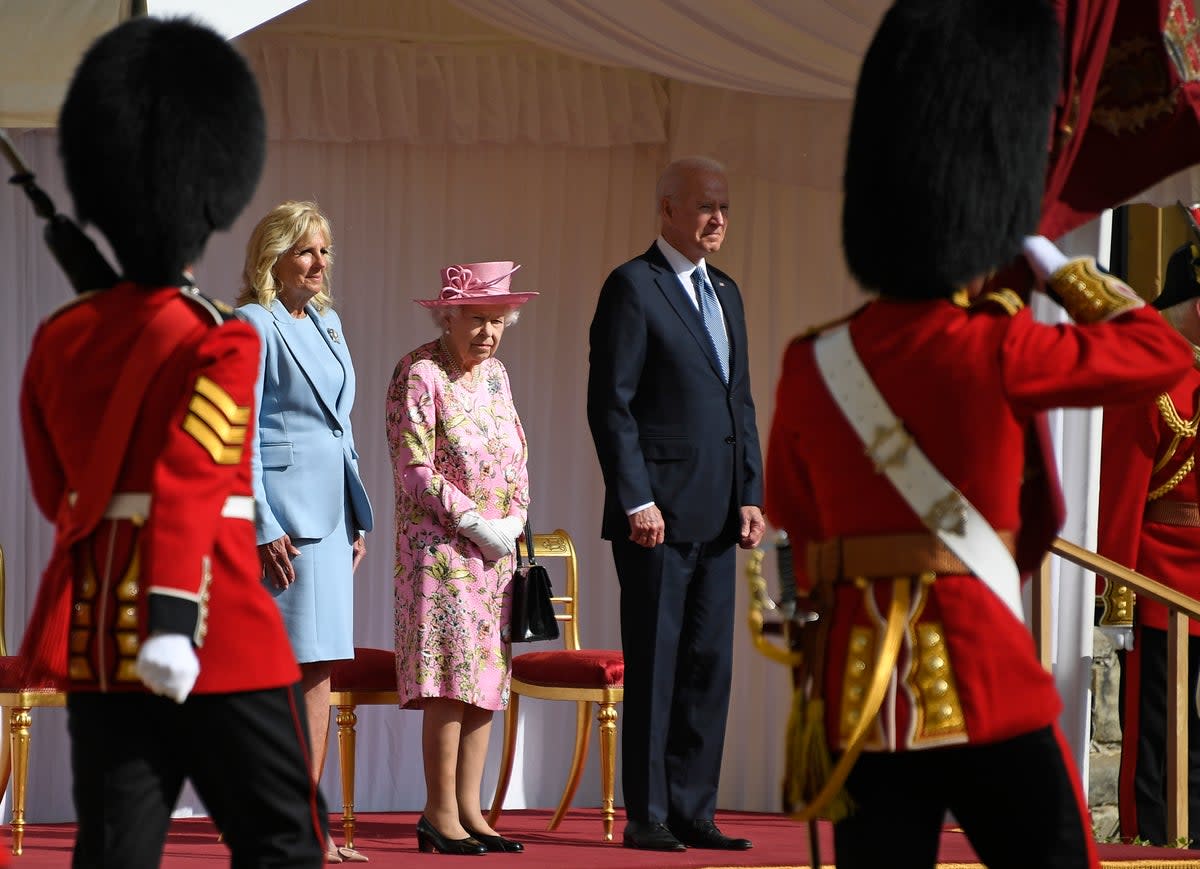 US President Joe Biden takes a salute from a Guard of Honour when he and First Lady Jill Biden met the Queen  (AP)