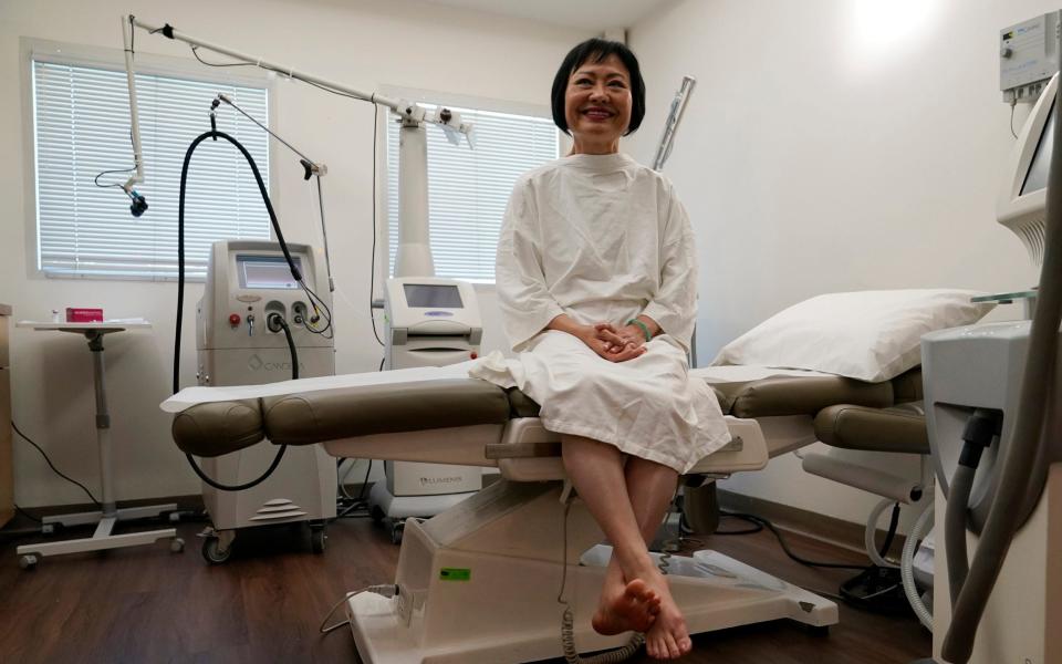 Ms Phuc waits to receive her 12-hour laser treatment by Dr. Jill Waibel at the Miami Dermatology and Laser Institute - Lynne Sladky 