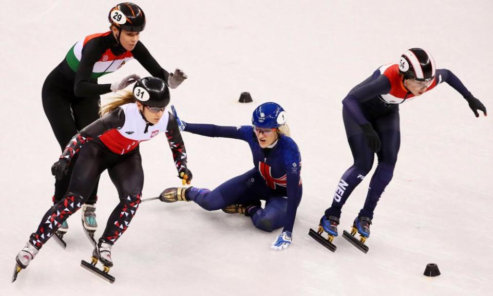 Elise Christie tumbles during the 1,000m heats