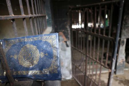 A Koran is seen in a destroyed structure in Marawi, southern Philippines May 22, 2018. REUTERS/Neil Jerome Morales