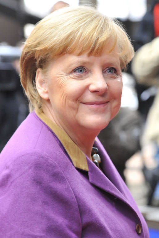 German Chancellor Angela Merkel arrives at EU headquarters in Brussels, on February 8, 2013. German Chancellor Angela Merkel said the deal "was worth the effort" and she "was glad that everyone showed the needed willingness to compromise."