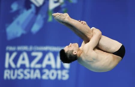 China's Qiu Bo jumps during the men's 10m platform semi-final at the Aquatics World Championships in Kazan, Russia August 1, 2015. REUTERS/Stefan Wermuth