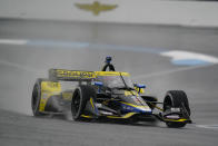 Colton Herta drives thought the second turn on his way to winning the IndyCar Grand Prix auto race at Indianapolis Motor Speedway in Indianapolis, Saturday, May 14, 2022. (AP Photo/Michael Conroy)