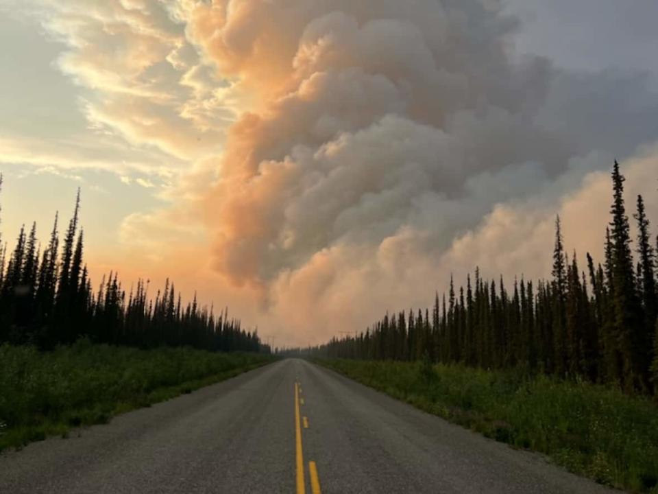 A photo of the Crystal Creek fire. Thick smoke from the fire, spanning 1,500 hectares, forced the Klondike Highway to close temporarily between Pelly Crossing and Stewart Crossing. (Yukon Protective Services/ Facebook - image credit)