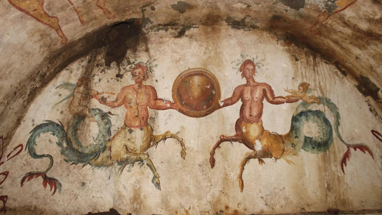  We see two ichthyocentaurs, which are part man, part horse and part fish, next to two cherubs on a half-circle wall. 