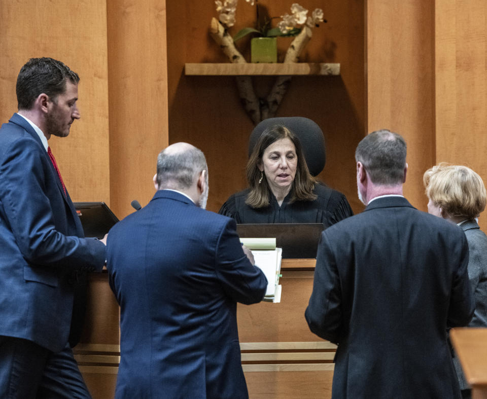 Superior Court Justice Amy Messer talks with the lawyers during the trial of Adam Montgomery at Hillsborough County Superior Court, Thursday, Feb. 22, 2024, in Manchester, N.H. Montgomery has been convicted of second-degree murder in the death of his 5-year-old daughter. Police believe Harmony Montgomery was killed nearly two years before she was reported missing in 2021. (Jeffrey Hastings/Pool Photo via AP)