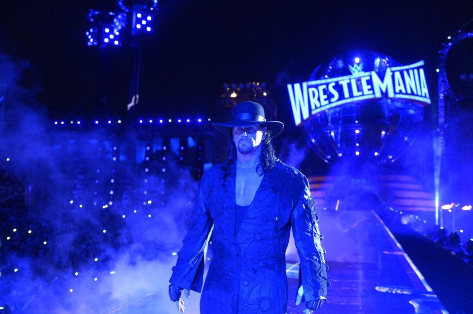 The Undertaker enters the ring at WrestleMania 33 to face Roman Reigns