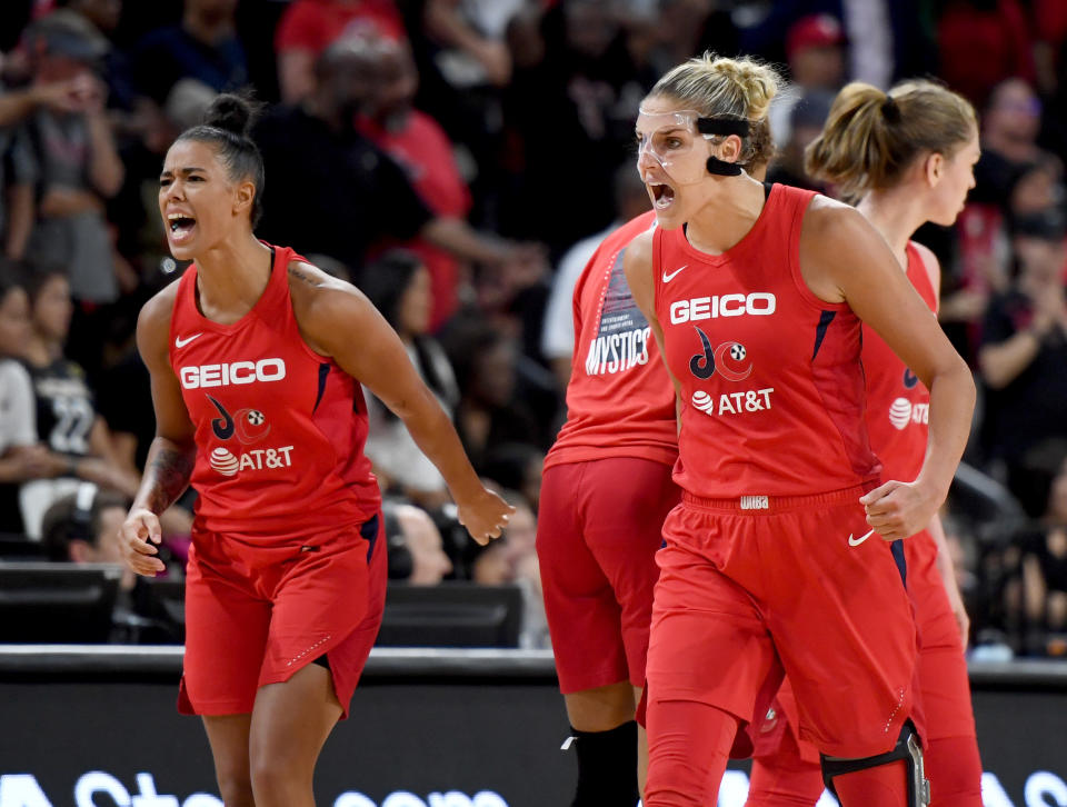 LAS VEGAS, NEVADA - SEPTEMBER 24:  Natasha Cloud (L) #9 and Elena Delle Donne #11 of the Washington Mystics react after the team scored against the Las Vegas Aces during Game Four of the 2019 WNBA Playoff semifinals at the Mandalay Bay Events Center on September 24, 2019 in Las Vegas, Nevada. The Mystics defeated the Aces 94-90 and won the series 3-1. NOTE TO USER: User expressly acknowledges and agrees that, by downloading and or using this photograph, User is consenting to the terms and conditions of the Getty Images License Agreement.  (Photo by Ethan Miller/Getty Images)