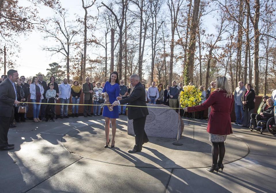 Survivors, family and community members attend a ribbon cutting ceremony Dec. 1, 2017, at the new location of a memorial for the victims of the Heath High School shooting. (Photo: Ryan Hermens/The Paducah Sun)