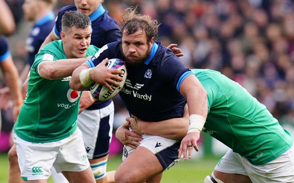 Scotlandâ€™s Pierre Schoeman is tackled by Irelandâ€™s Jonny Sexton (left) during the Guinness Six Nations match at BT Murrayfield Stadium, Edinburgh