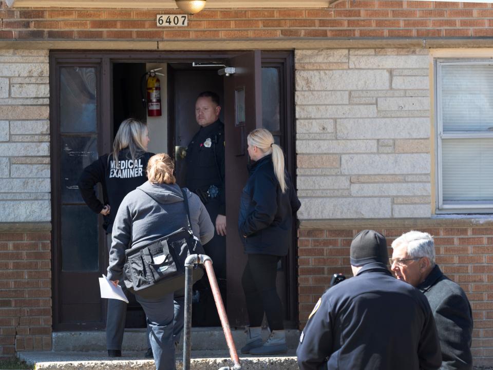 Milwaukee Police work at the scene of a triple homicide Sunday, March 27, 2022 at 6407 N. 54th St. in Milwaukee, Wis.