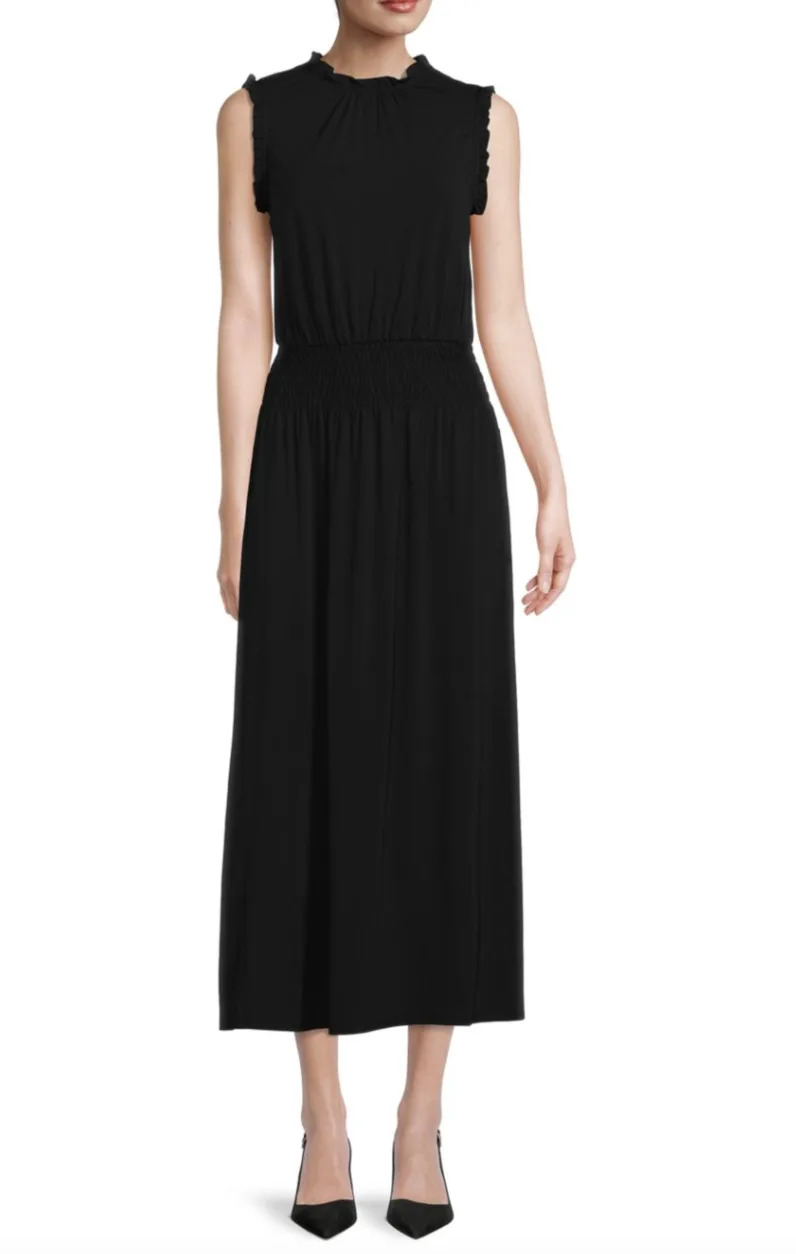 woman in sleeveless black dress, H Halston ​Shirred Waist Maxi Dress in black (Photo via Saks Off Fifth)