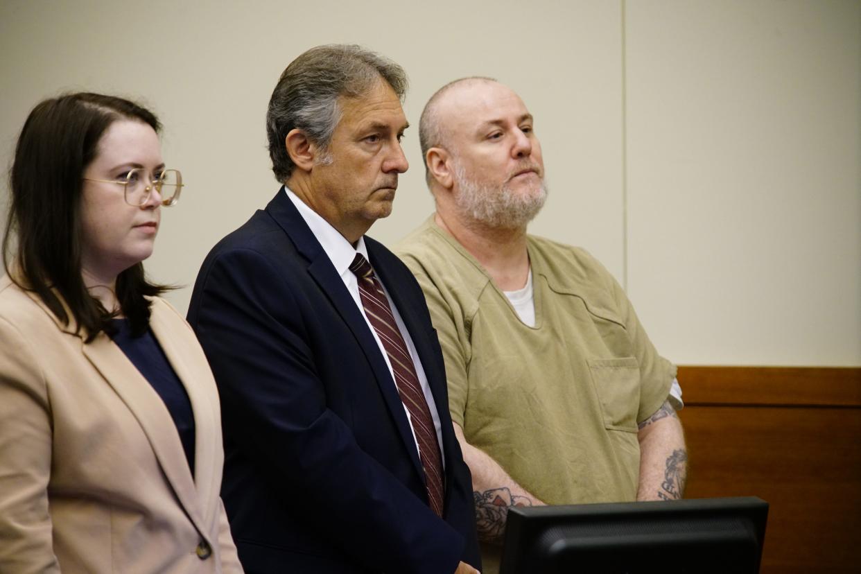 Robert M. Muncy, 47, right, was sentenced Friday, Sept. 29, 2023, by Franklin County Common Pleas Court Judge Carl Aveni to an indefinite prison term of 10 years to 15 years for his Sept. 12, 2023, guilty plea to voluntary manslaughter to avoid a trial on murder charges for fatally shooting 26-year-old Brandon Williams on Oct. 30, 2020, outside a home on Columbus' South Side. Sarah Paxton Ballard, left, and Mike W. Morgan, right, were Munch's Franklin County Public Defense attorneys,