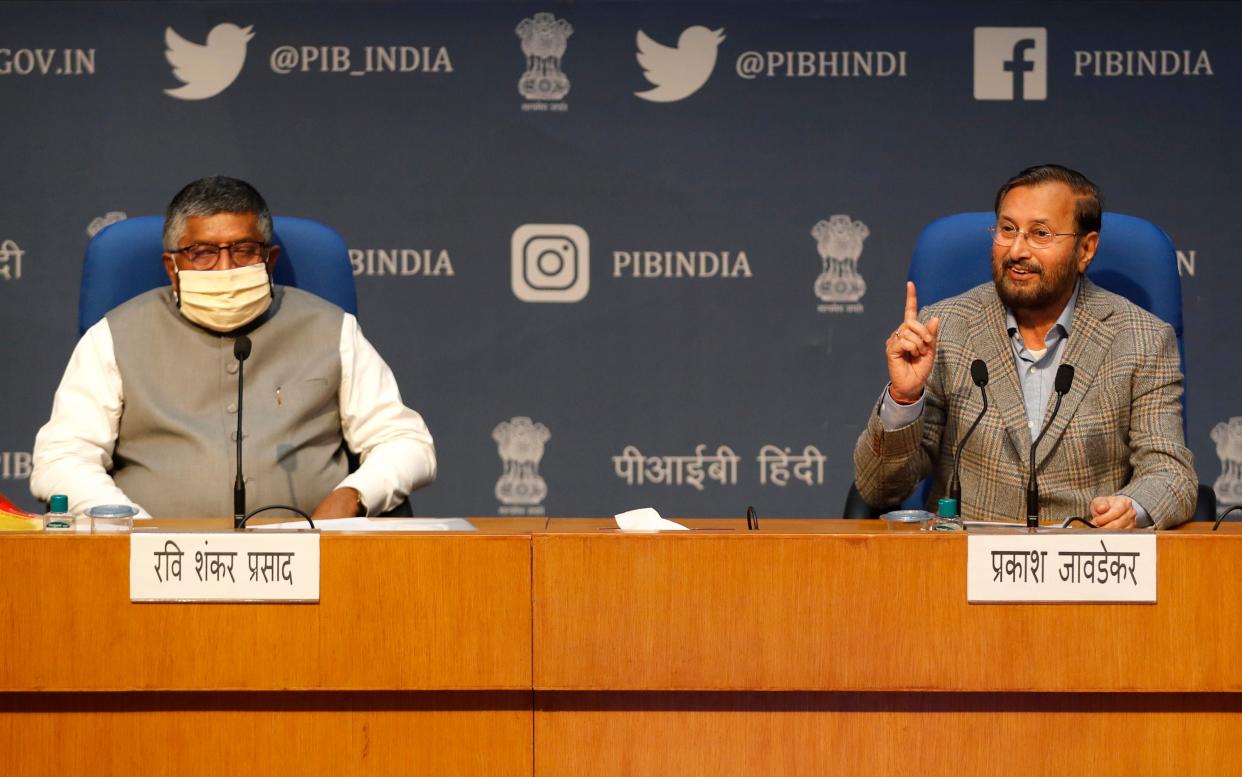 File image: India's IT Minister Ravi Shankar Prasad, left, and Information and Broadcasting Minister Prakash Javadekar address a press conference announcing new regulations for social media companies in February (AP)