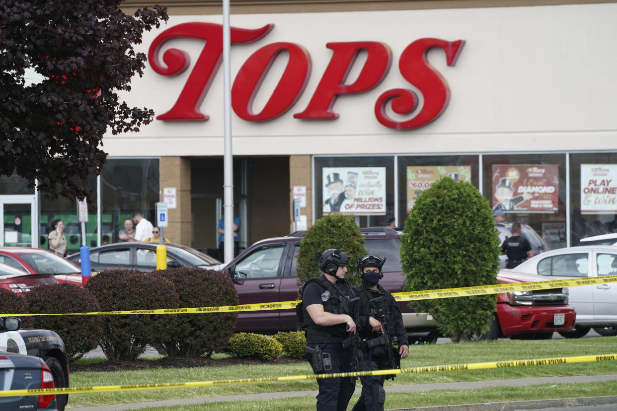 Police secure an area around a supermarket where 10 people were killed in a shooting, May 14, 2022, in Buffalo, N.Y. (Derek Gee/The Buffalo News via AP)