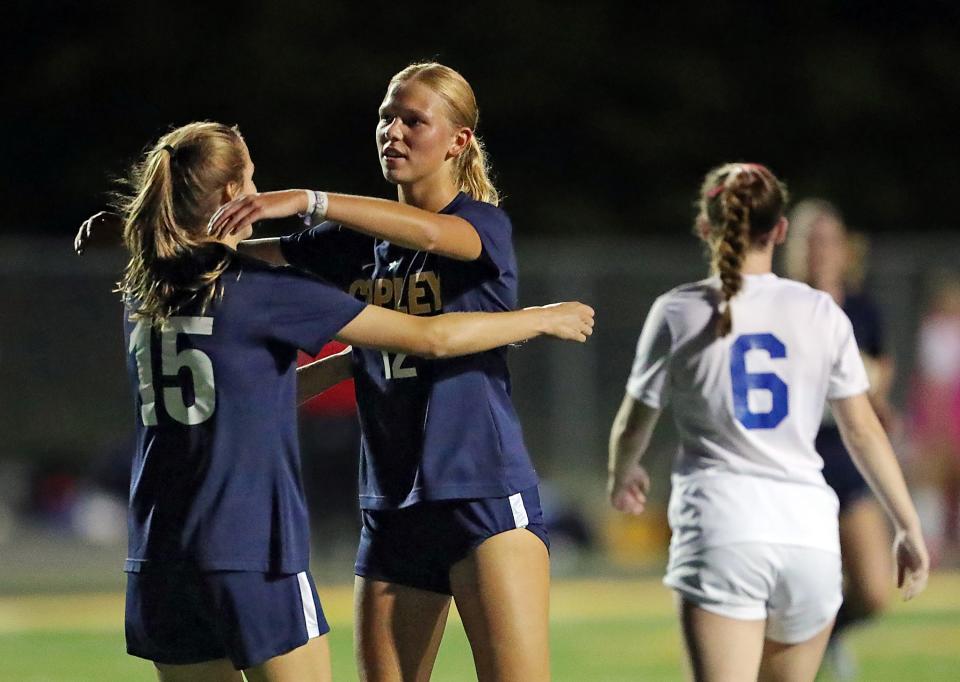 Copley's Kate Young, left, and Emily Kerekes celebrate after a goal against Revere during the first half Wednesday in Copley.