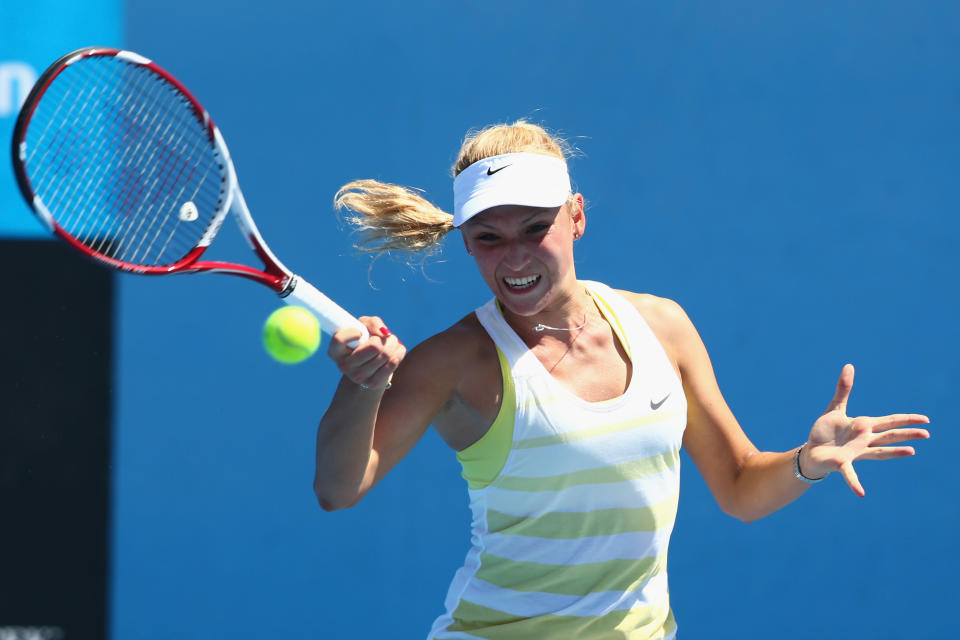 Donna Vekic of Croatia plays a forehand in her first round match against Andrea Hlavackova of the Czech Republic during day two of the 2013 Australian Open at Melbourne Park on January 15, 2013 in Melbourne, Australia. 