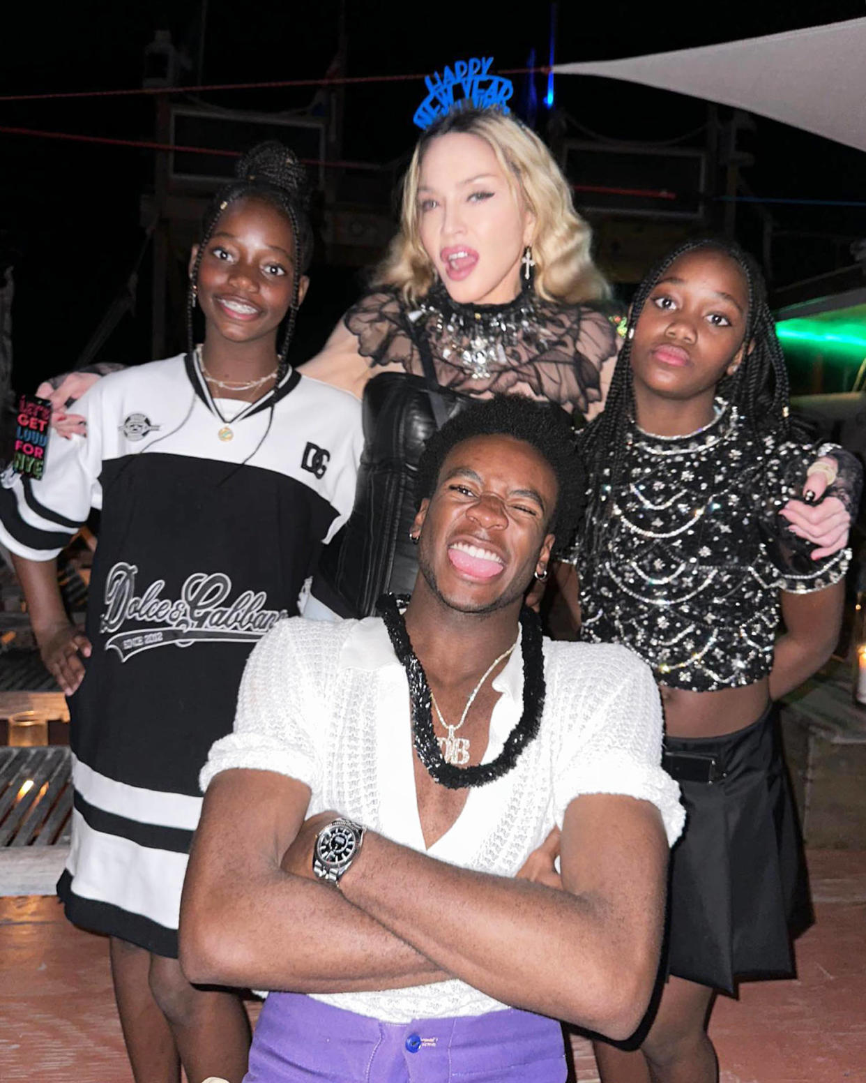 Madonna poses with three of her kids, David, Stella and Estere, at a New Year's Eve celebration. (@madonna via Instagram)