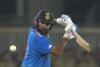 India's captain Rohit Sharma plays a shot during the ICC Men's Cricket World Cup match between India and Pakistan in Ahmedabad, India, Saturday, Oct. 14, 2023.(AP Photo/Rajanish Kakade)
