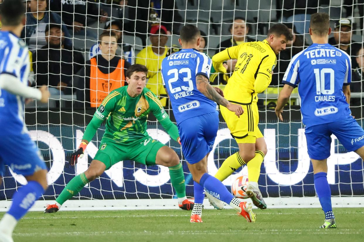 Apr 24, 2024; Columbus, OH, USA; Columbus Crew goalkeeper Patrick Schulte (28) saves a shot from CF Monterrey forward Brandon Vazquez (23) during the first half of the Concacaf Champions Cup semifinals at Lower.com Field.