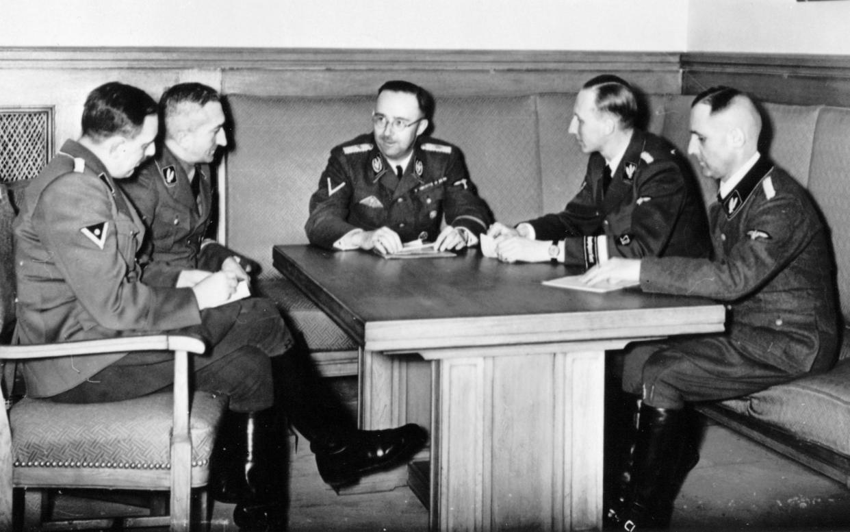 Heinrich Himmler and his colleagues at a meeting. From left: Franz Josef Huber (secret state police), Arthur Nebe (criminal investigation department), Heinrich Himmler, Reinhard Heydrich (security service) and Heinrich Muller (secret state police, also known as Gestapo-Muller) - ullstein bild via Getty Images