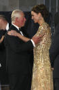 Britain's Prince Charles, left, reacts with Kate, the Duchess of Cambridge as they arrive for the World premiere of the new film from the James Bond franchise 'No Time To Die', in London, Tuesday, Sept. 28, 2021. (Chris Jackson/Pool Photo via AP)