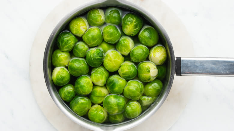 Brussels sprouts boiling in a pan