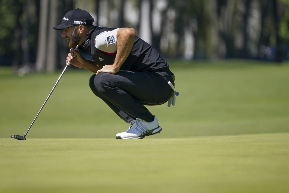 Dustin Johnson, of the United States, lines up a putt on the fifth green during the third round of the US Open Golf Championship, Saturday, Sept. 19, 2020, in Mamaroneck, N.Y. (AP Photo/John Minchillo)