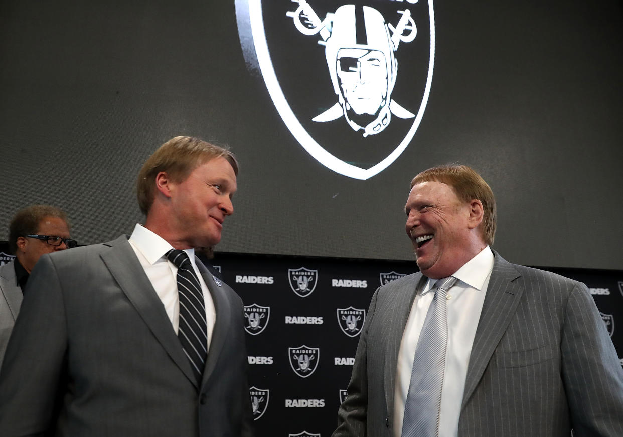 ALAMEDA, CA - JANUARY 09:  Oakland Raiders new head coach Jon Gruden (L) talks with Raiders owner Mark Davis during a news conference at Oakland Raiders headquarters on January 9, 2018 in Alameda, California. Jon Gruden has returned to the Oakland Raiders after leaving the team in 2001.  (Photo by Justin Sullivan/Getty Images)
