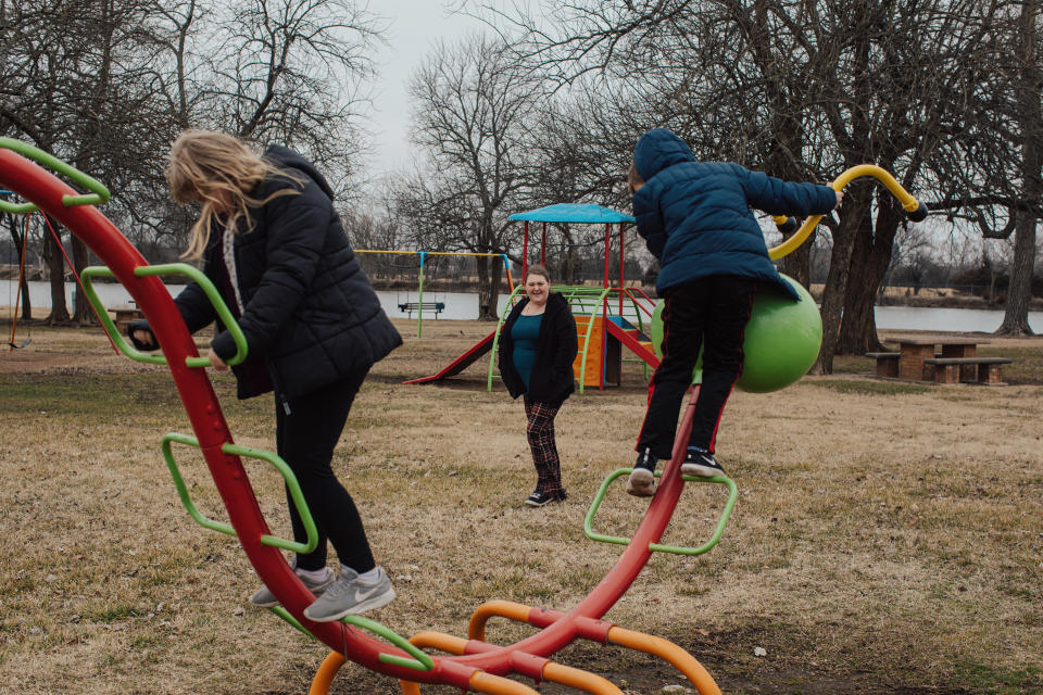 Tami Burch watches as her kids Mia and Jesse play at a park.  (Photo: Chase Castor for HuffPost)