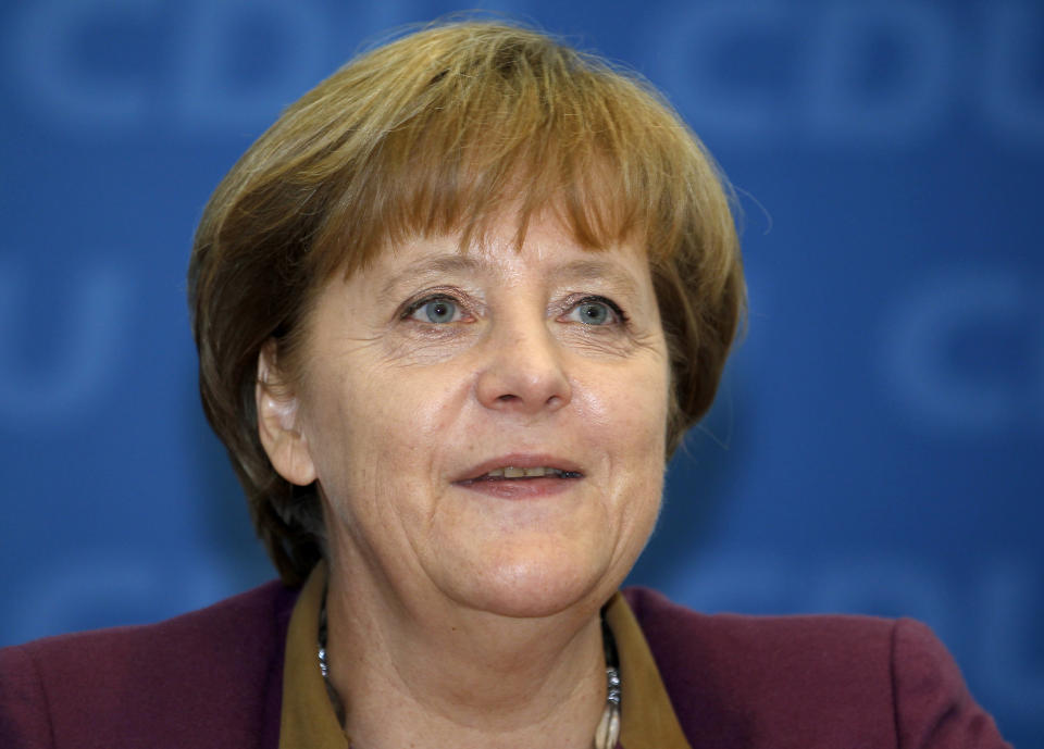 German Chancellor and chairwoman of the German Christian Democrats, CDU, Angela Merkel, smiles at the beginning of the party's weekly executive committee meeting in Berlin, Germany, Monday, March 26, 2012 one day after the Saarland state elections. Chancellor Angela Merkel's party won the state election in western Germany Sunday, making a promising start to a difficult series of regional ballots this year. (AP Photo/Michael Sohn)