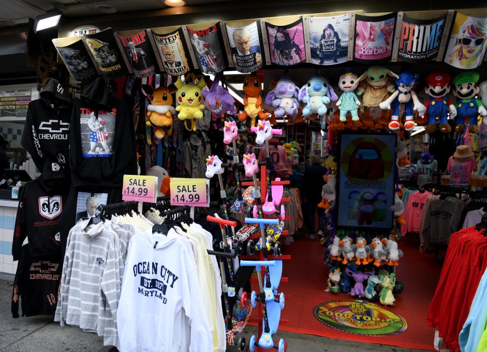 Shirts for sale at shops on the boardwalk Friday, May 3, 2024, in Ocean City, Maryland.