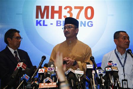 Malaysia's acting Transport Minister Hishammuddin Tun Hussein takes questions from journalists during a news conference about the missing Malaysia Airlines flight MH370, at Kuala Lumpur International Airport March 14, 2014. REUTERS/Edgar Su