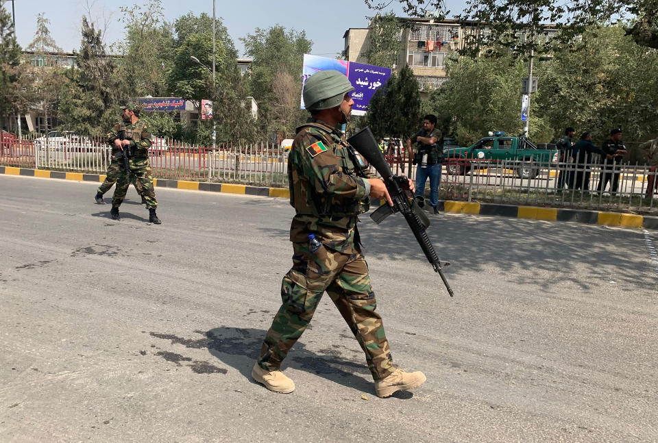 Afghan army soldiers arrive at the site of a car bomb blast in Kabul, Afghanistan, Thursday, Sept. 5, 2019. A large car bomb rocked the Afghan capital on Thursday and smoke rose from a part of eastern Kabul near a neighborhood housing the U.S. Embassy, the NATO Resolute Support mission and other diplomatic missions. (AP Photo/Rahmat Gul)