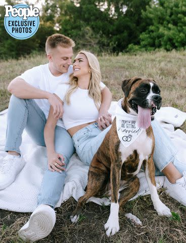 <p>Tiffany Maysonet @tiffanymaysonetphoto</p> Owens and Strong pose with dog Bella Roo in their engagement photos
