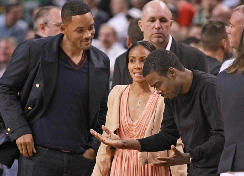 closeup of will, jada, and chris outside at an event