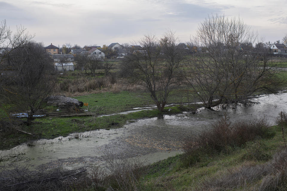 A view of a flooded area in the village of Demydiv, about 40 kilometers (24 miles) north of Kyiv, Ukraine, Thursday, Oct. 27, 2022. After the flood in Demydiv, residents said their tap water turned cloudy, tasted funny and left a film on pots and pans after cooking. The village was under Moscow's control until April, when Russian troops withdrew after failing to take the capital. (AP Photo/Andrew Kravchenko)