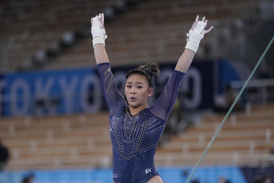 Sunisa Lee of the United States, performs on the uneven bars during the artistic gymnastics women's apparatus final at the 2020 Summer Olympics, Sunday, Aug. 1, 2021, in Tokyo, Japan. (AP Photo/Ashley Landis)