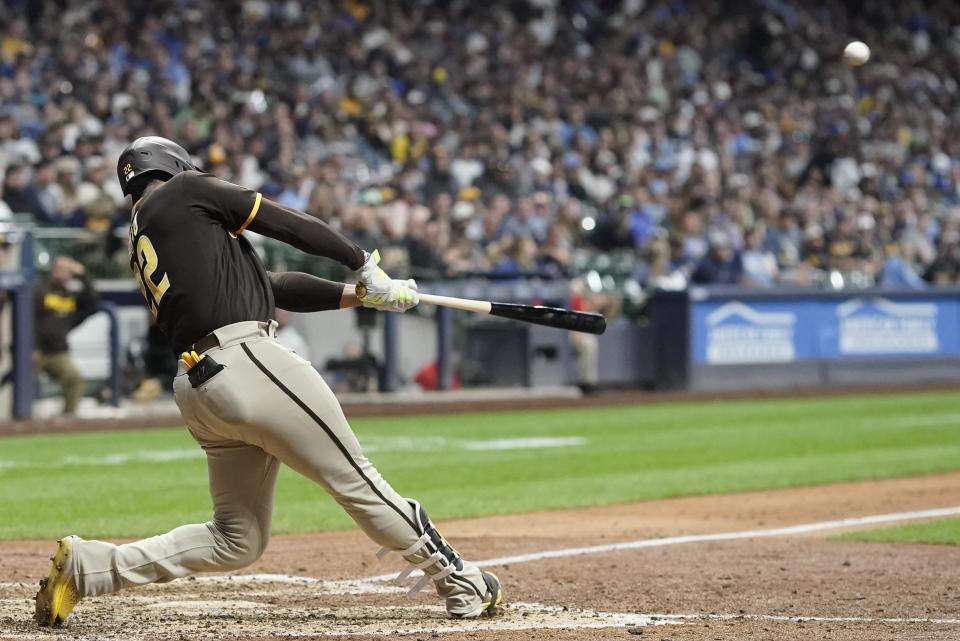 San Diego Padres' Juan Soto hits a two-run home run during the eighth inning of a baseball game against the Milwaukee Brewers Saturday, Aug. 26, 2023, in Milwaukee. (AP Photo/Morry Gash)