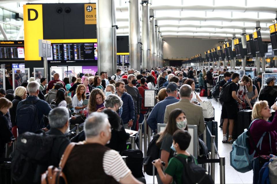 Passengers queue inside the departures terminal of Terminal 2 at Heathrow Airport in London, Britain, June 27, 2022. (REUTERS)