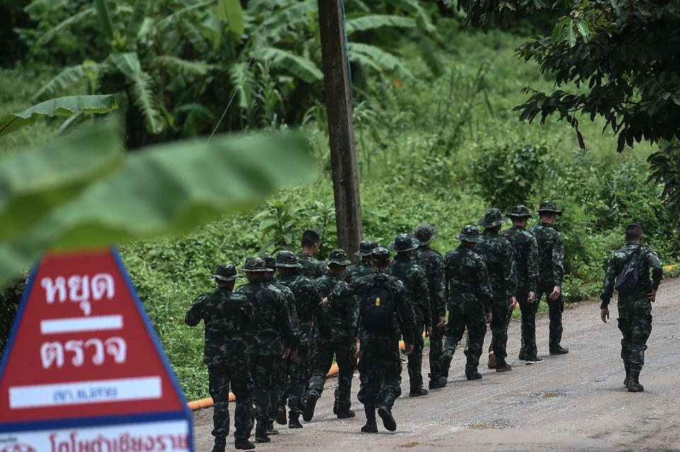 Thai soldiers walk into to the Tham Luang cave area as the operations continue for the boys and their soccer coach still trapped inside. Source: Getty Images