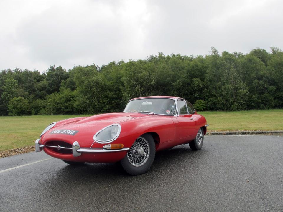 <p>You can't mention Grand Touring cars without bringing up the Jaguar E-Type. It's become an icon in the classic car world, sought after by collectors for its fantastic design and wonderful driving elements. You can own <a href="https://www.ebay.com/itm/1965-Jaguar-E-Type-4-2-liter-Series-1-Roadster/402331642504?hash=item5dacd5aa88:g:9p4AAOSwtM5fB0EM" rel="nofollow noopener" target="_blank" data-ylk="slk:this British racing green Series I model;elm:context_link;itc:0;sec:content-canvas" class="link ">this British racing green Series I model</a> today. </p>