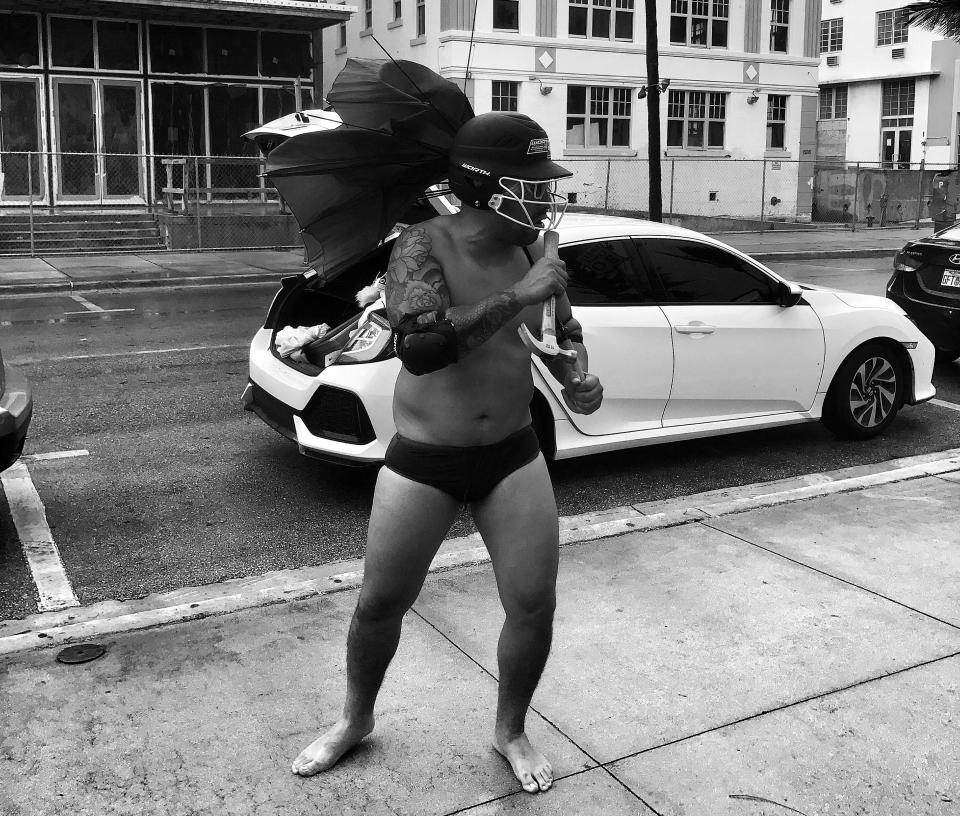 <p>A man in a football helmet and arm pads prepared to run into the ocean Saturday ahead of the arrival of Hurricane Irma in the South Beach section of Miami. (Photo: Holly Bailey/Yahoo News) </p>