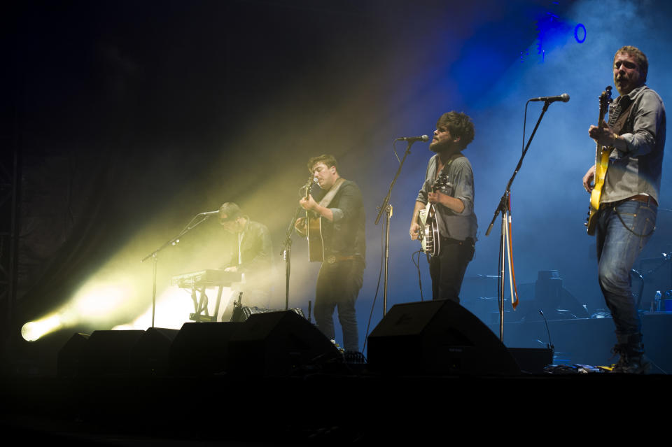 Mumford & Sons band members, from left, Ben Lovett, Marcus Mumford, Country Winston and Ted Dwane perform on Wednesday, Aug. 28, 2013 at the West Side Tennis Club in the Forest Hills neighborhood of the Queens borough of New York. (Photo by Charles Sykes/Invision/AP)