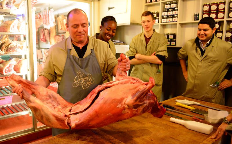 FILE PHOTO: Perry Bartlet teaches how to butcher lamb during a class run by "The Ginger Pig" butchers shop in London
