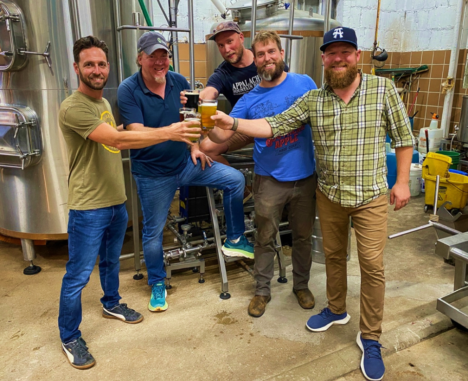 Green Man Brewery and Appalachian Mountain Brewery's teams are collaborating on a new beer to celebrate that AMB will be producing and distributing their beer from Green Man's South Slope production facility. Pictured (left to right): Ian Salzberg (Sales & Marketing Director, AMB), Dennis Thies (Co-owner, GMB), Nathan Kelishcek (Co-owner, AMB), Chris Zieber (Co-owner, AMB), Joe Sommers (Managing Director, GMB), Matt Peyton (Not pictured - Dir. Of Brewery Ops, GMB)