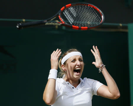 Timea Bacsinszky of Switzerland celebrates after winning her match against Monica Niculescu of Romania at the Wimbledon Tennis Championships in London, July 6, 2015. REUTERS/Stefan Wermuth