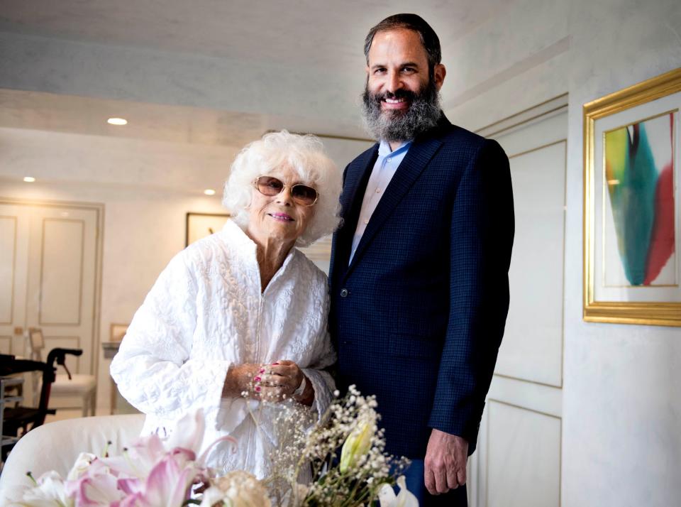 Holocaust survivor Jacqueline Goldman with Rabbi Moshe Scheiner of Palm Beach Synagogue May 25 at her home. Goldman celebrated her bat mitzvah at the temple on May 27.