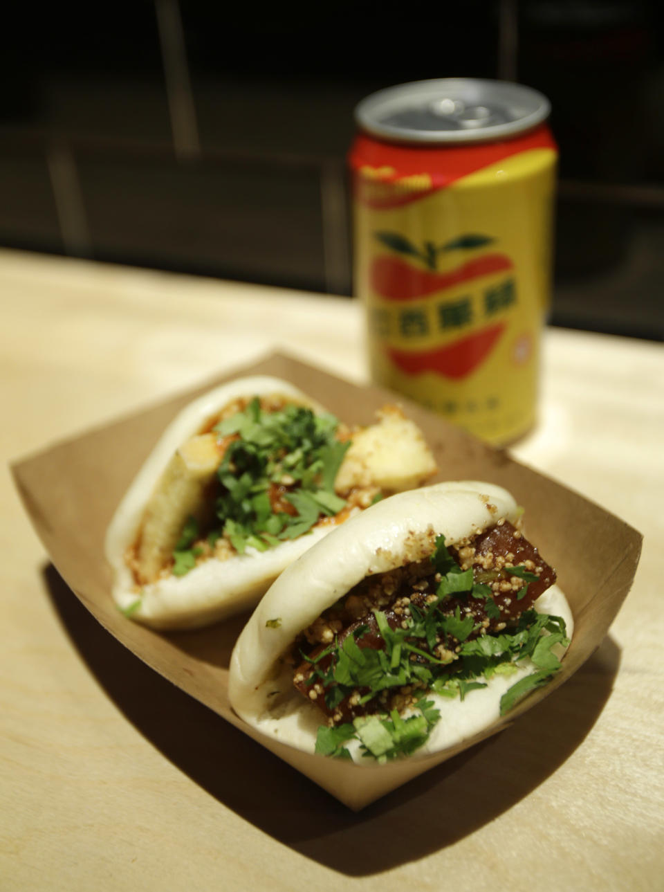 This Monday, Jan. 28, 2013 photo shows the Chairman Bao and Uncle Jesse bao at chef Eddie Huang's Baohaus in New York. (AP Photo/Seth Wenig)