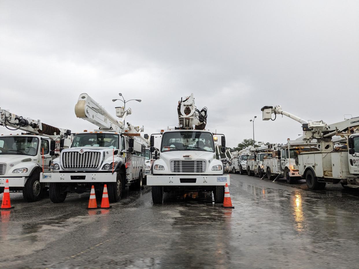 Linesmen and other power crews were marshaling at the old Kmart store parking lot in Wilmington Wednesday as the region prepares for the arrival of Tropical Storm Idalia.